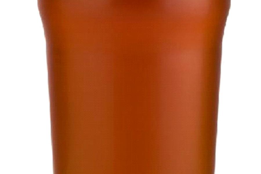 Vaso de cerveza con espuma.